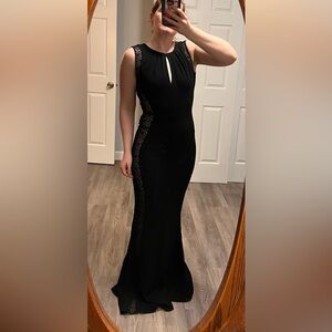 Black/lacy evening gown that looks stunning on! Lace side panels